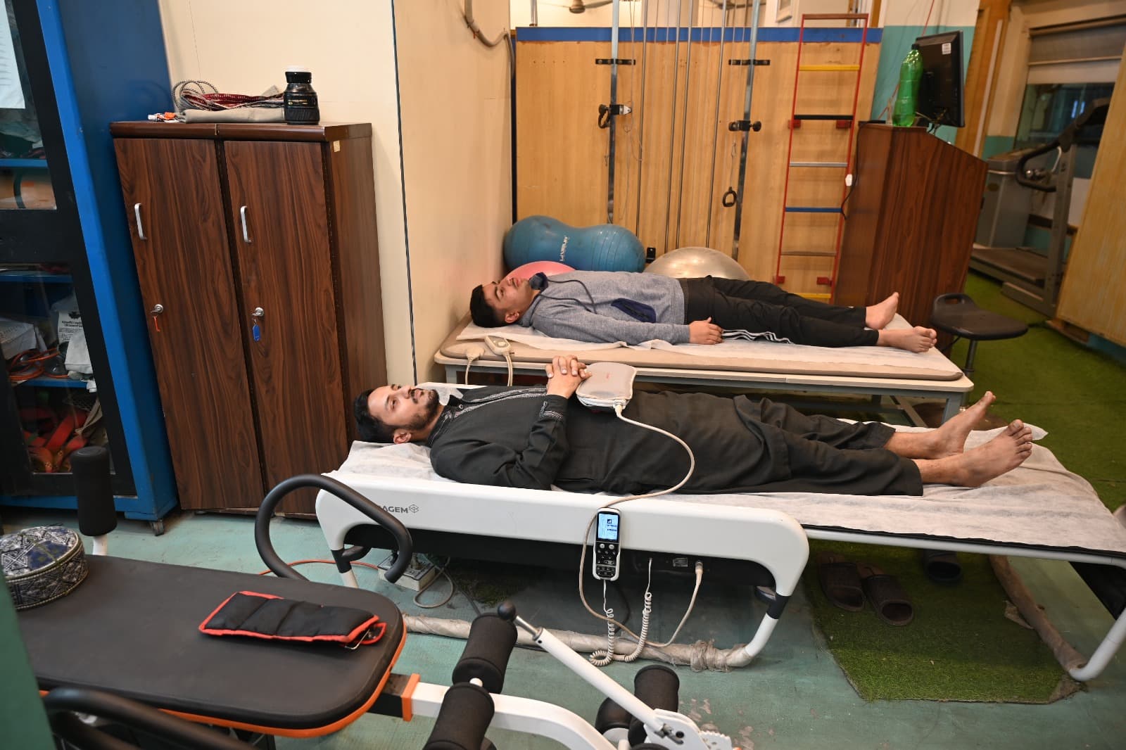 Physiotherapy suite with treatment beds and rehab equipment